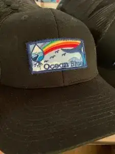 Ocean-Blue-Project-logo-Rainbow-hats-handmade