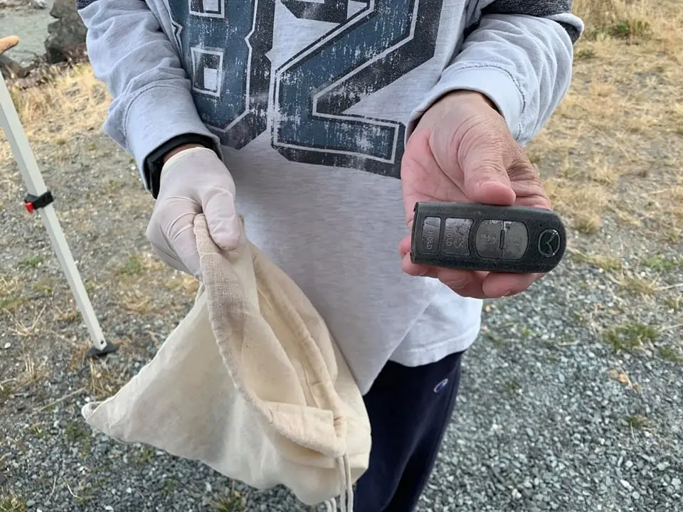 Volunteer protects one of his hands with latex glove 